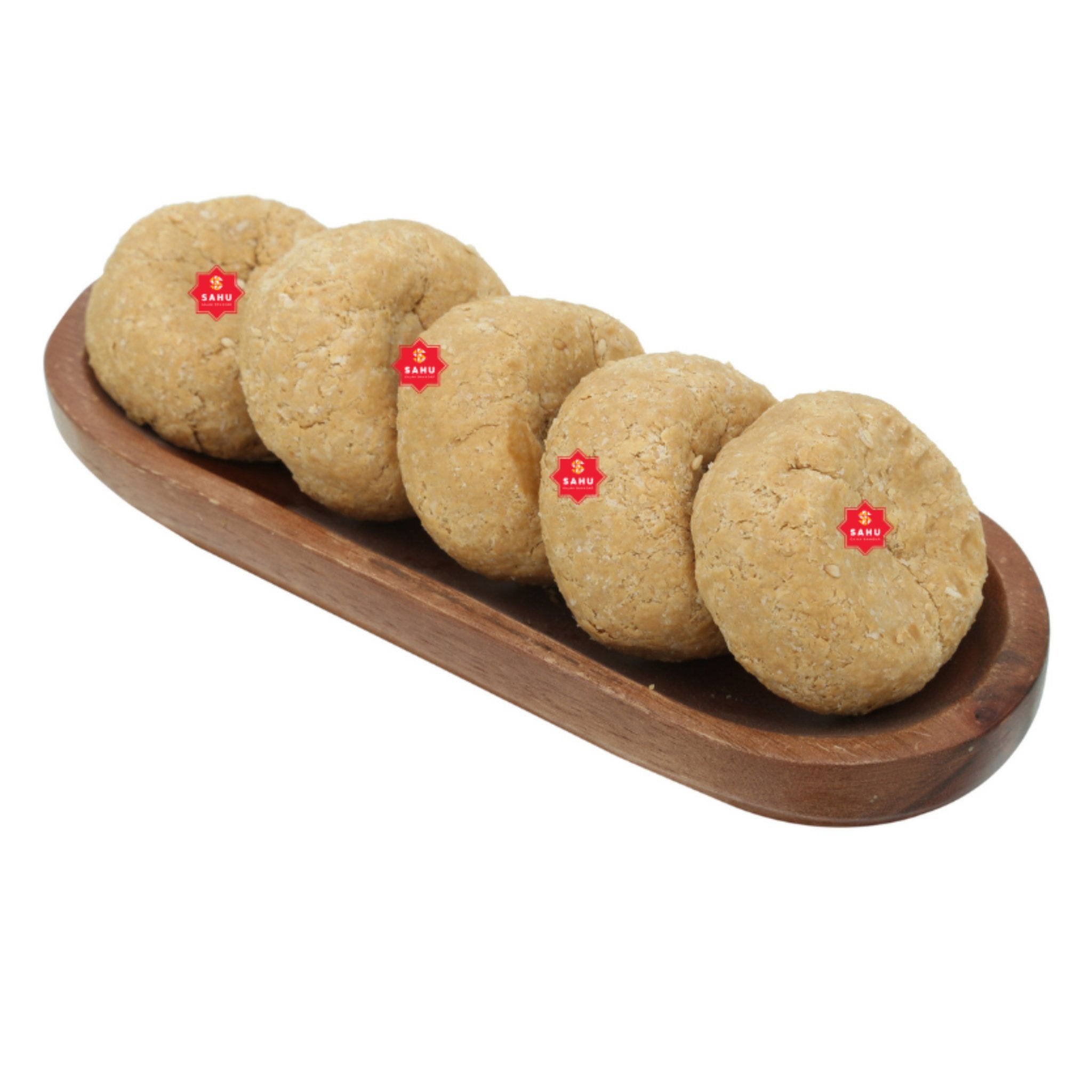 a row of cookies sitting on top of a wooden tray